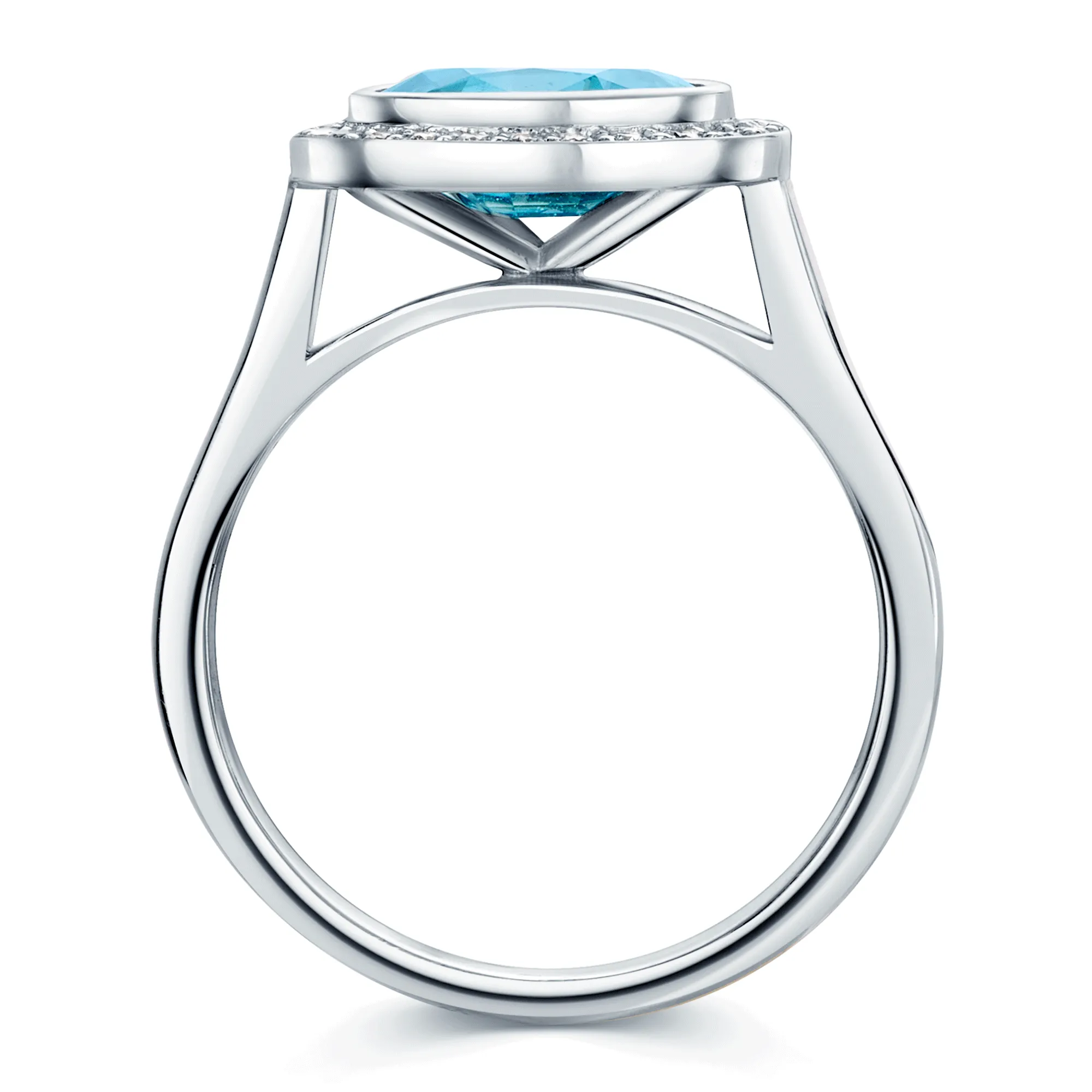 18ct White Gold Oval Cut Blue Zircon And Round Brilliant Diamond Rub Over Halo Dress Ring