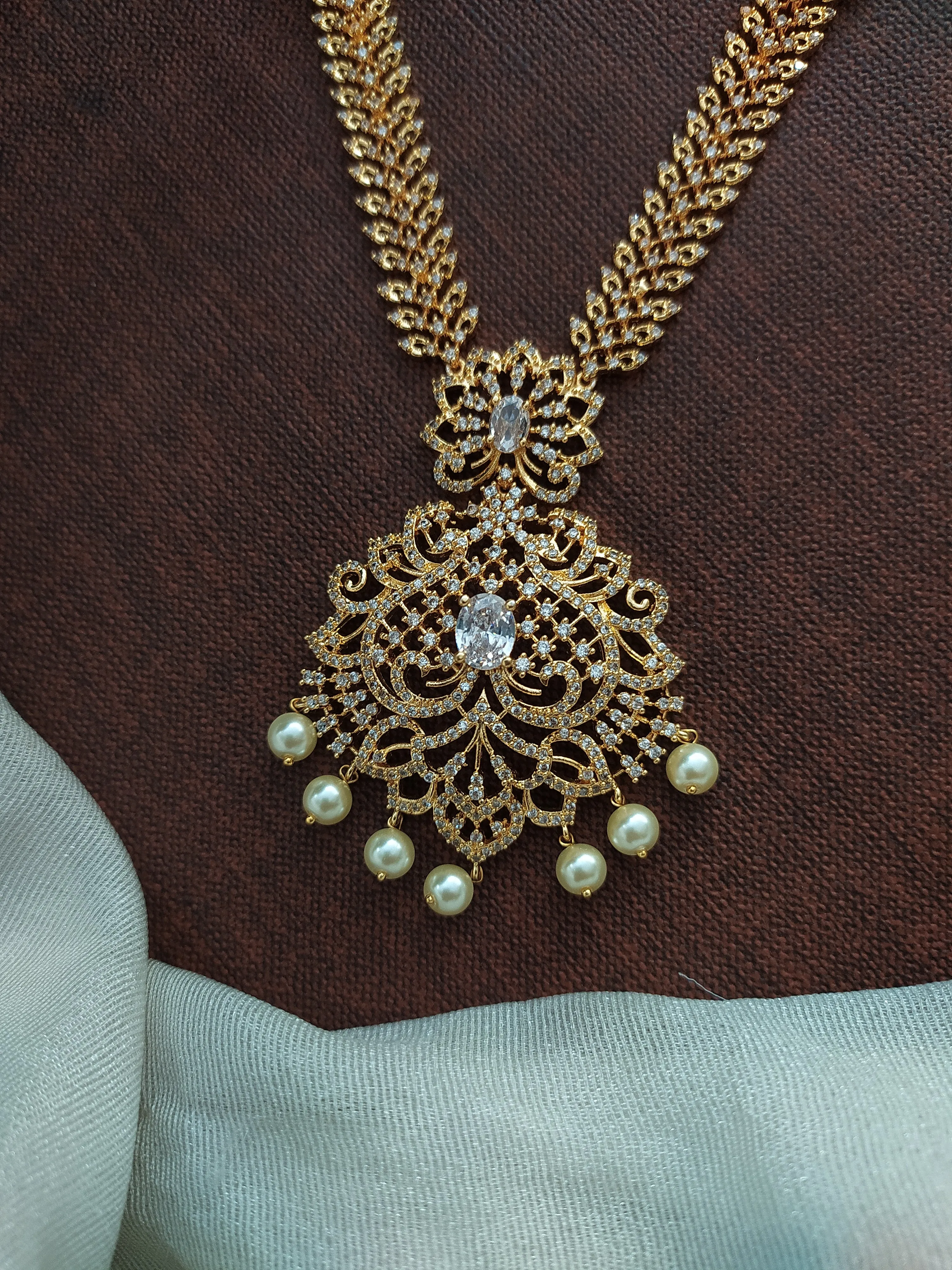 Enchanting Embrace Of Gold Plated Zircon & Pearl Long Haram Set