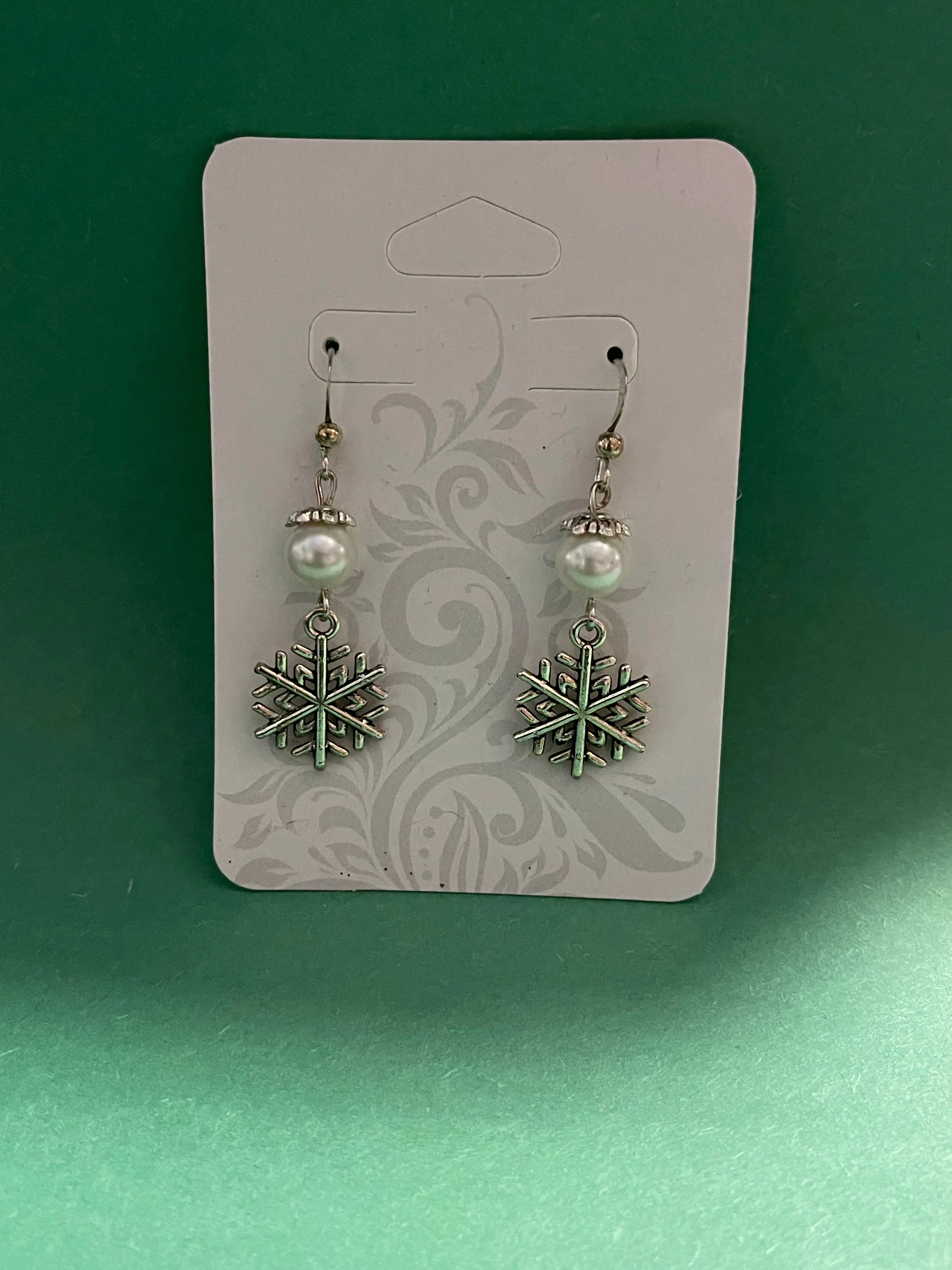 Pearl and snowflake earrings